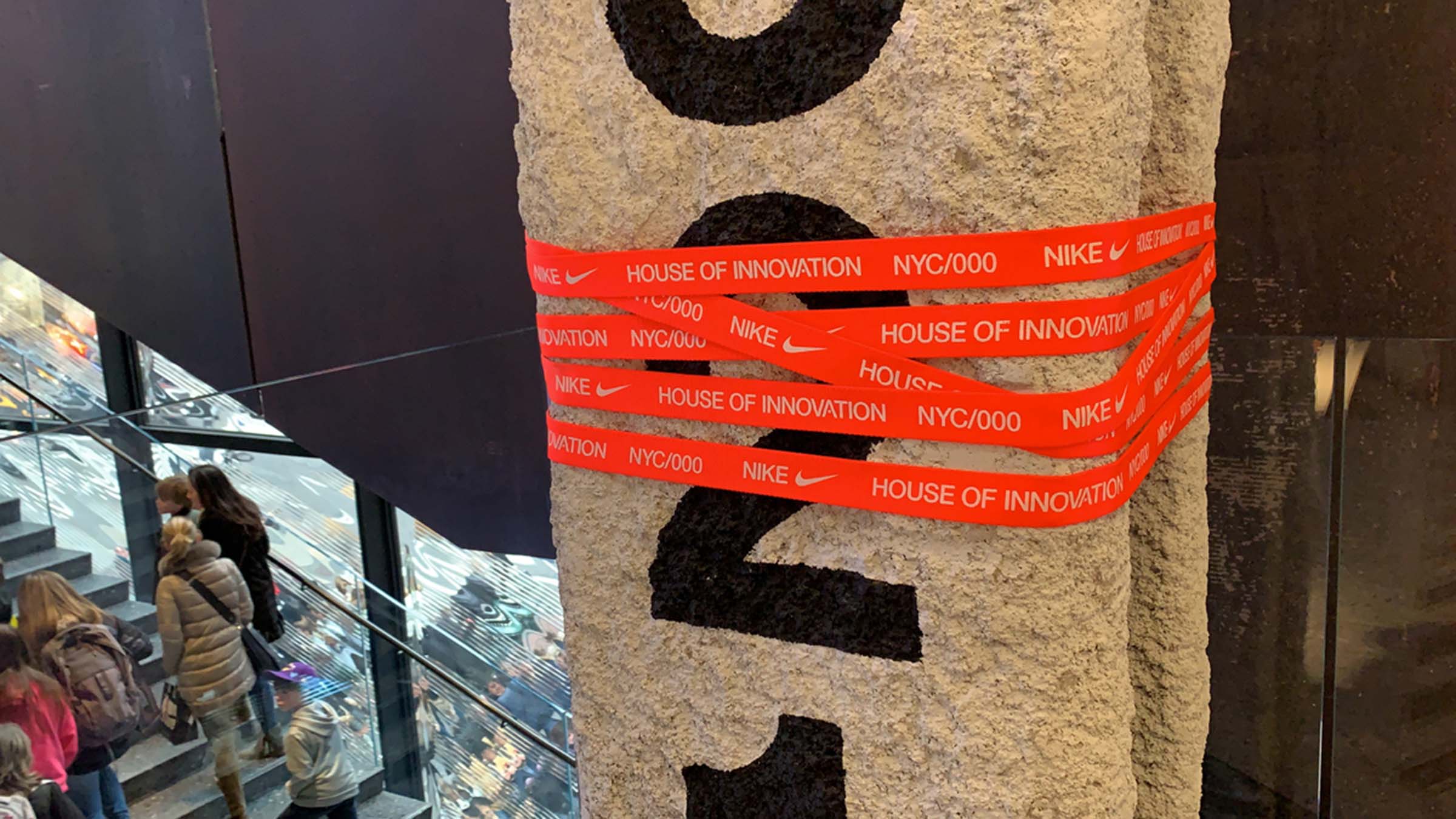 Nike NYC House of Innovation red branded tape on a beam