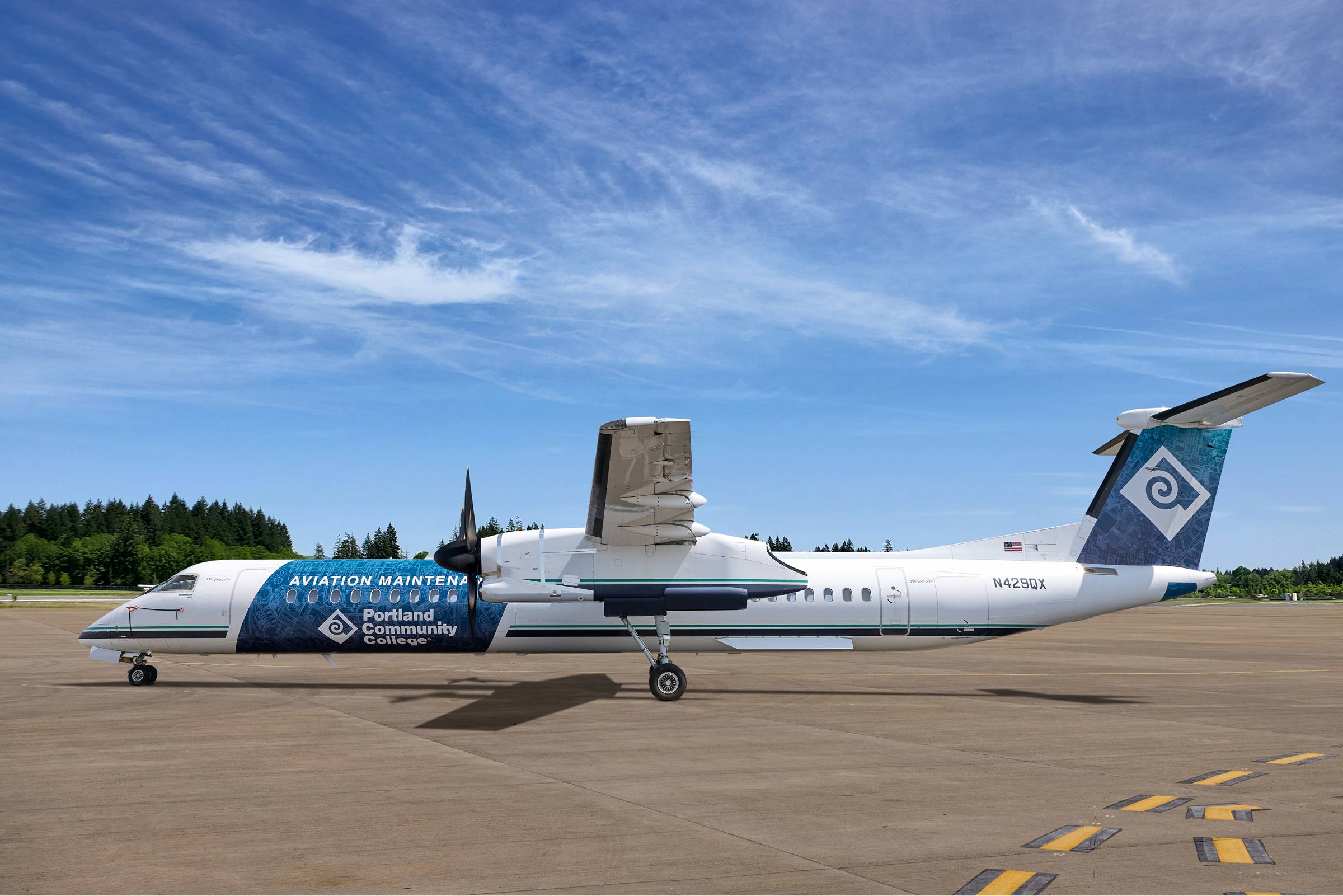 Portland Community College’s vinyl wrapped aircraft featuring a blueprint design.