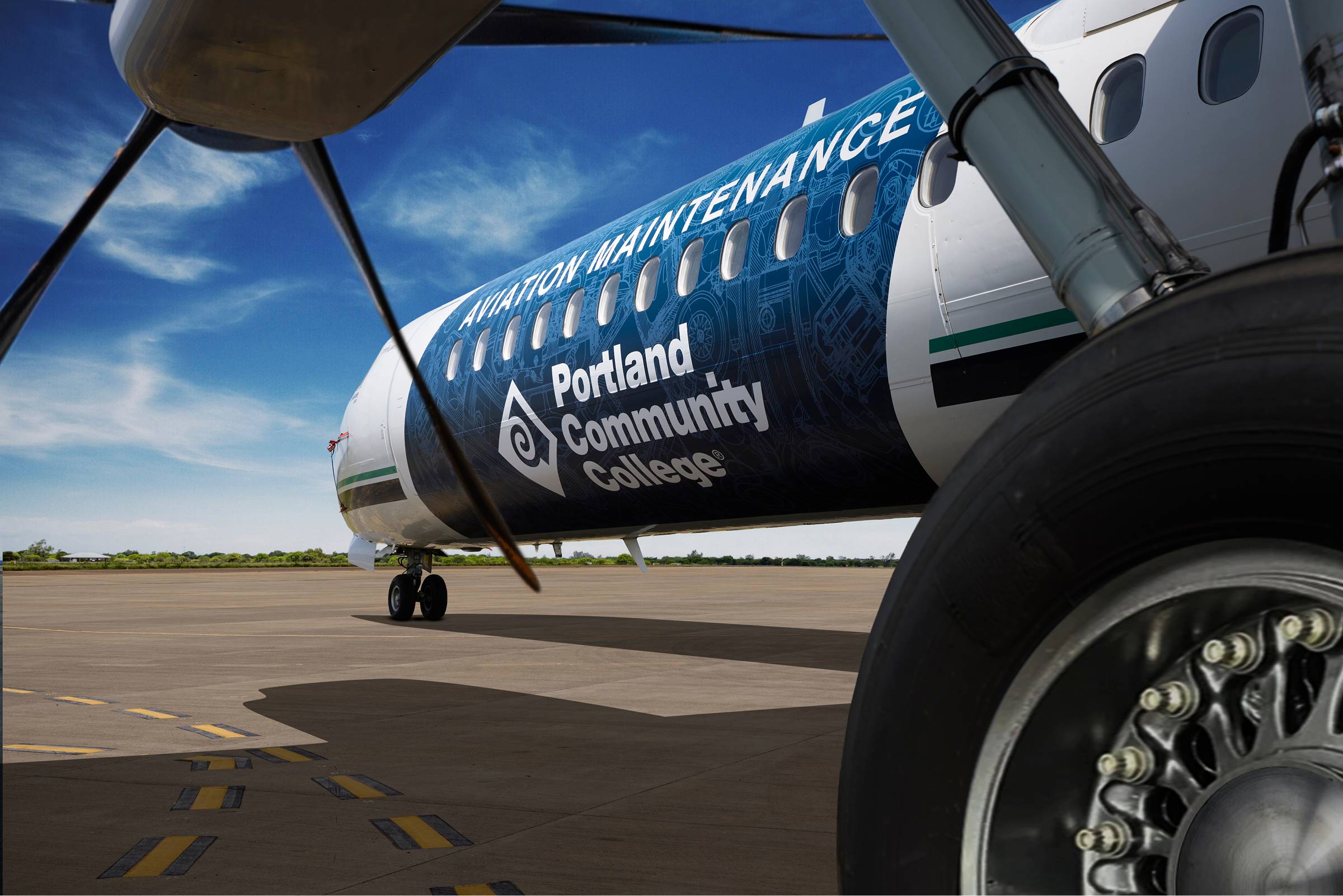 Portland Community College’s vinyl wrapped aircraft featuring a blueprint design.